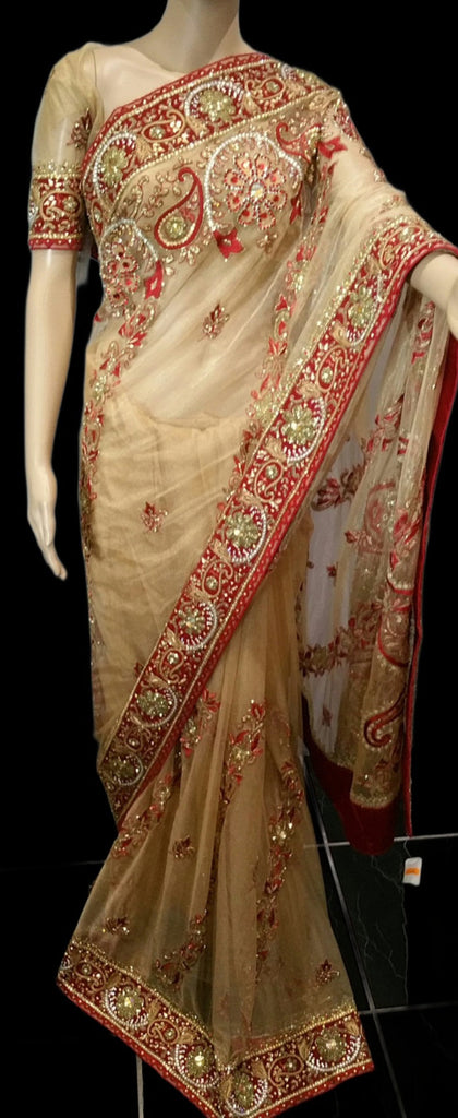 Net saree with rich embroidery and stonework detail